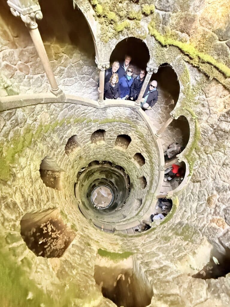 A cruise guest exploring the initiation well in quinta da regaleira in one of our tuk tuks โ just 45 minutes after leaving Lisbon port.