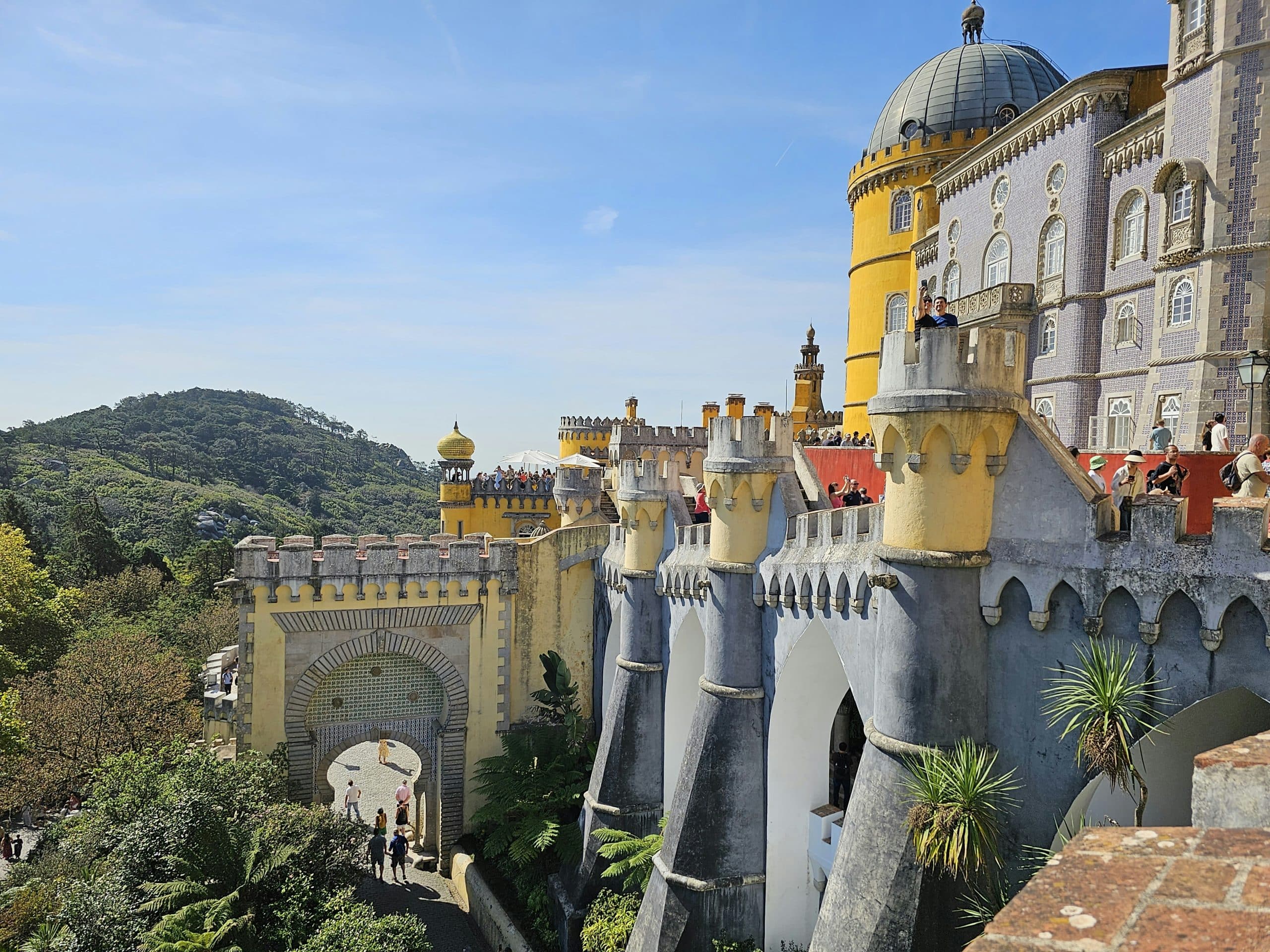 Terraces, colorful walls and an arched passage at Pena Palace in Sintra