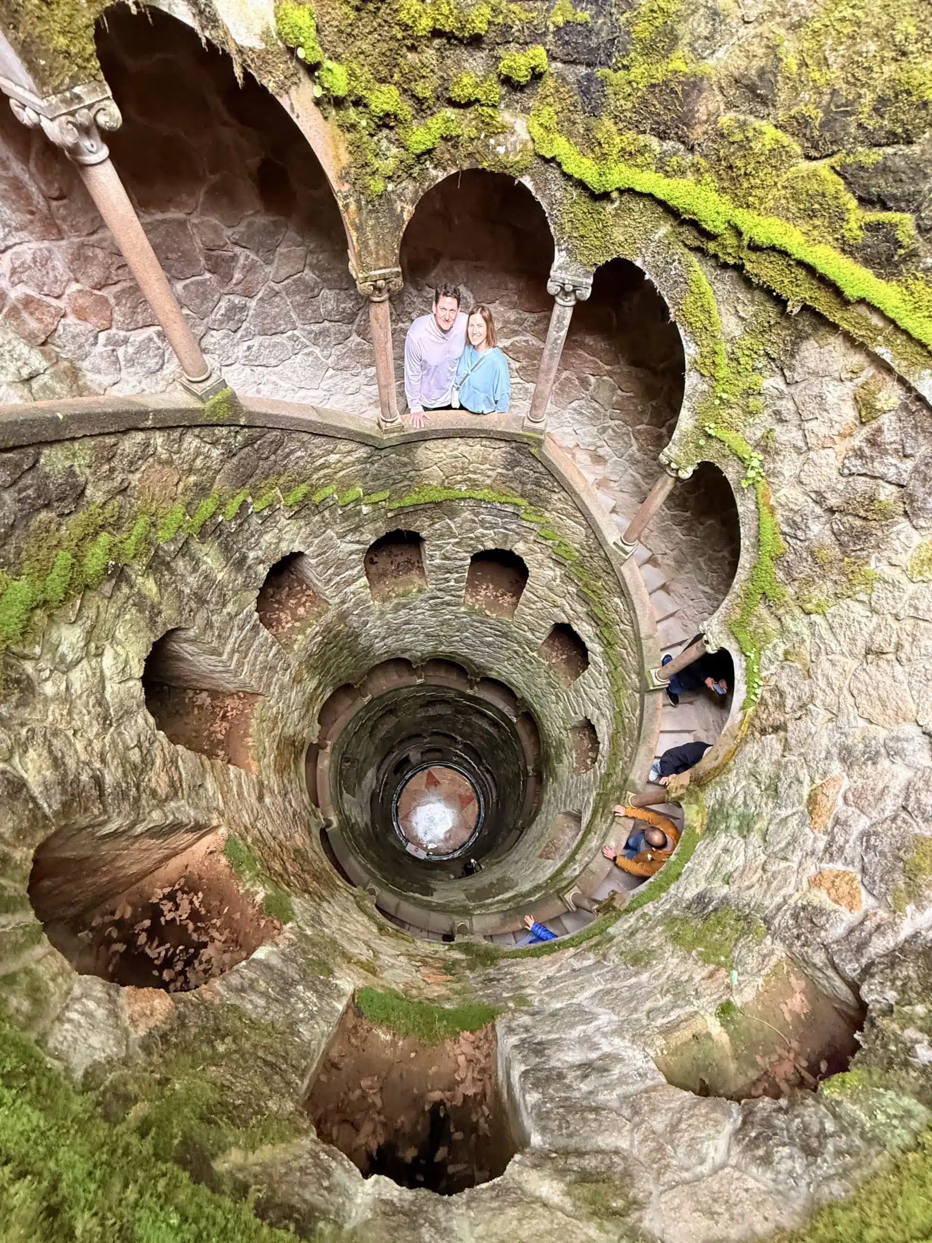 Guests inside the Initiation Well at Quinta da Regaleira