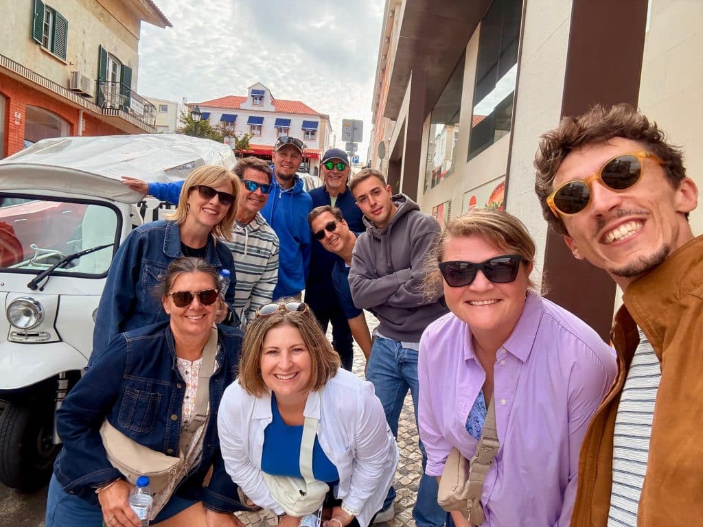 A guide and a group of visitors enjoying their visit together