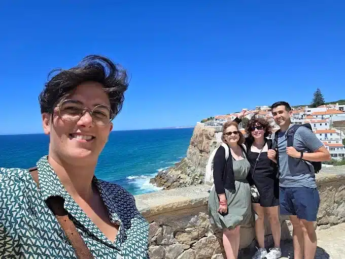 A guide and guests overlooking Azenhas do Mar