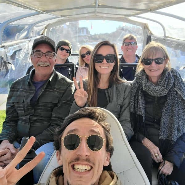 Happy group enjoying a private electric tuk tuk tour in Sintra with Daniel Ponce from Yes, You Deserve! โ sunshine, smiles and unforgettable views in Portugal.