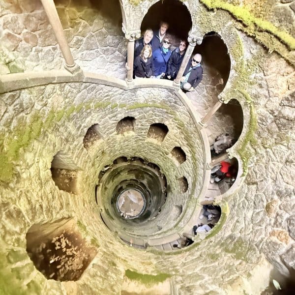 A cruise guest exploring the initiation well in quinta da regaleira in one of our tuk tuks โ just 45 minutes after leaving Lisbon port.